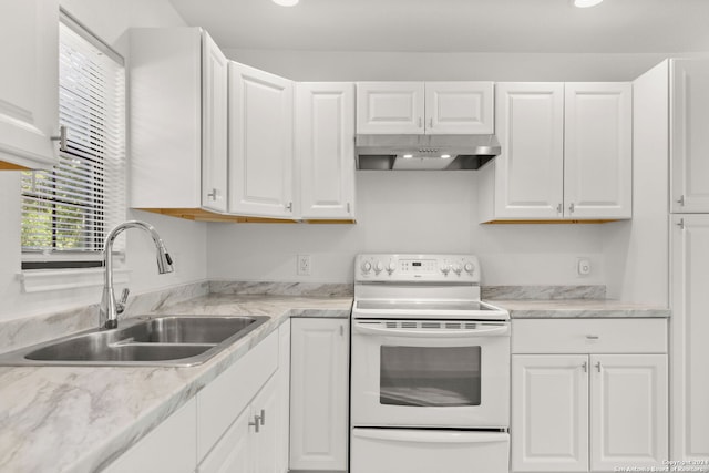 kitchen featuring white cabinetry, sink, and white electric stove