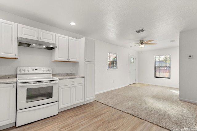 kitchen featuring white cabinetry, electric range, ceiling fan, a textured ceiling, and light wood-type flooring