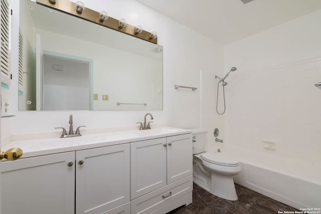 full bathroom featuring vanity, tiled shower / bath combo, and toilet