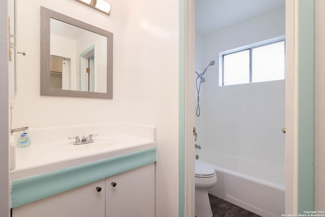 full bathroom featuring vanity, toilet, and tiled shower / bath combo