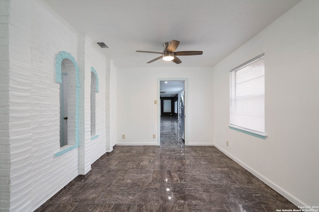 spare room with ceiling fan