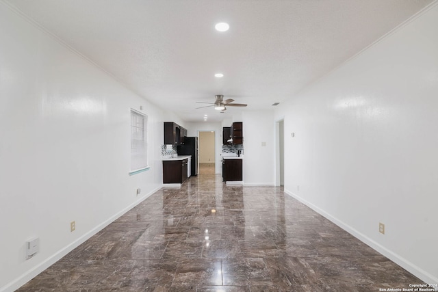 unfurnished living room with a textured ceiling, ceiling fan, and crown molding