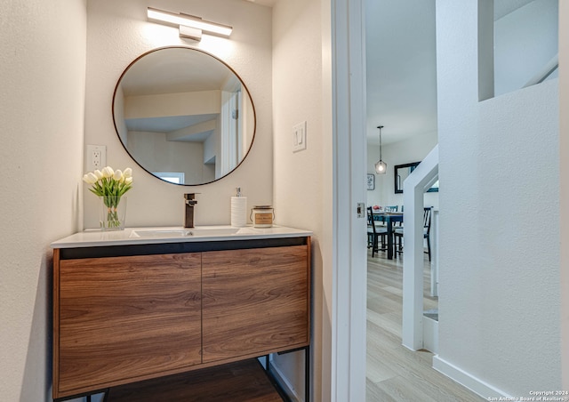 bathroom featuring vanity and hardwood / wood-style flooring