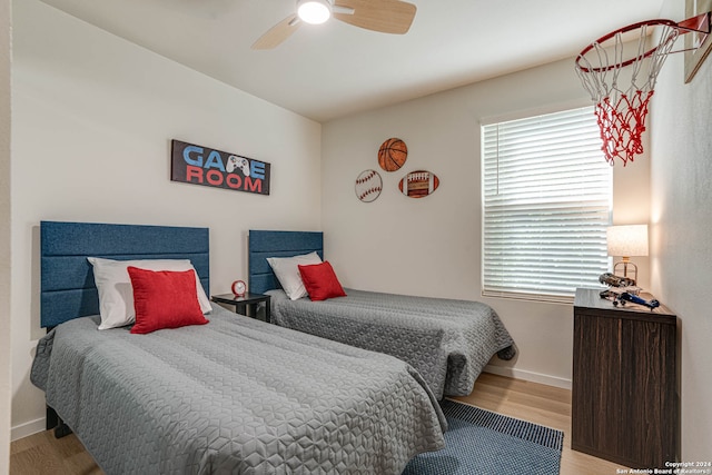 bedroom featuring ceiling fan and light hardwood / wood-style flooring