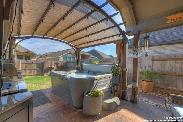 view of patio / terrace featuring a hot tub