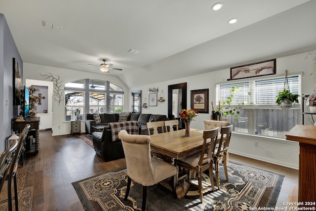 dining room with dark wood-type flooring, ceiling fan, and lofted ceiling