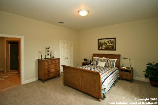 bedroom with light carpet