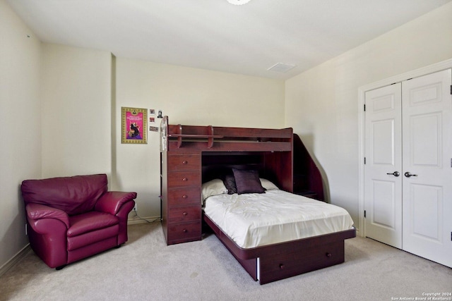 carpeted bedroom with a closet