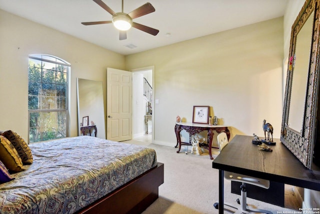 bedroom with light colored carpet and ceiling fan