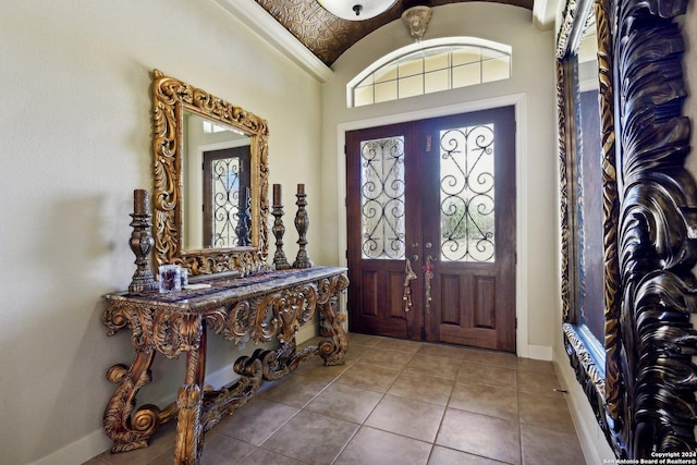 315 Dona Ana Cv, Helotes, TX 78023 - tiled entrance foyer featuring lofted ceiling and baseboards