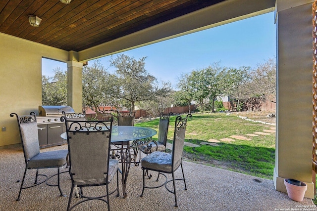 view of patio with a grill and an outdoor kitchen