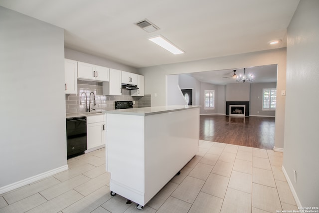 kitchen featuring ceiling fan, sink, light hardwood / wood-style floors, white cabinets, and black appliances