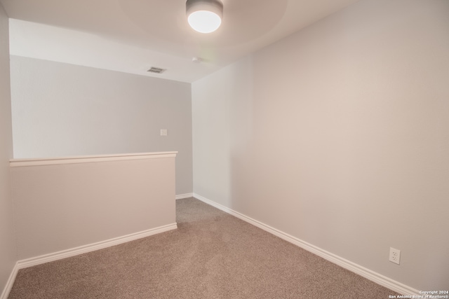 unfurnished room featuring carpet flooring