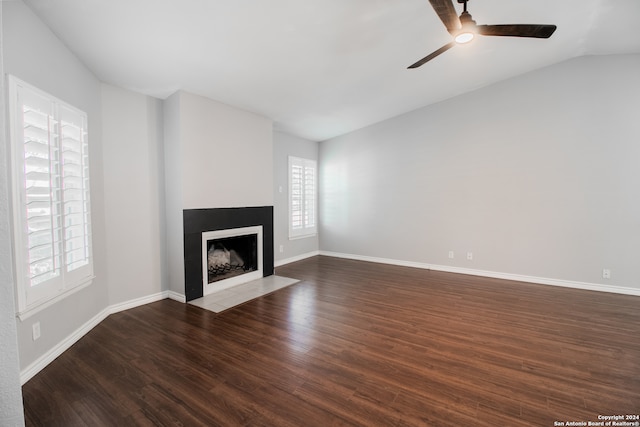 unfurnished living room featuring vaulted ceiling, ceiling fan, and dark hardwood / wood-style floors