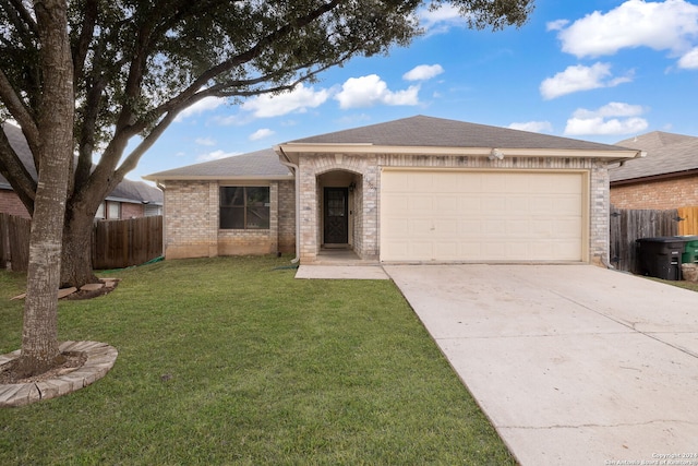 ranch-style home with a front lawn and a garage