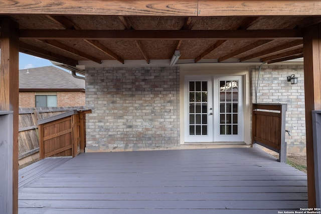 wooden deck featuring french doors