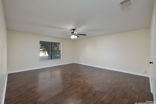 spare room featuring a textured ceiling, ceiling fan, and dark hardwood / wood-style floors