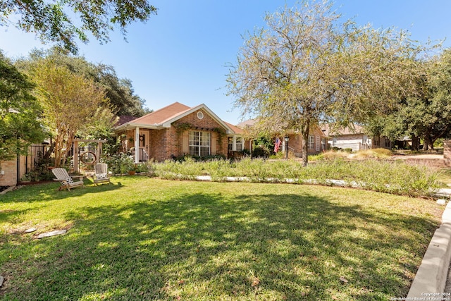 single story home with a front yard