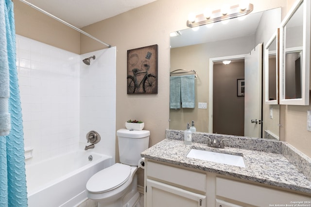 full bathroom with vanity, toilet, and shower / tub combo with curtain