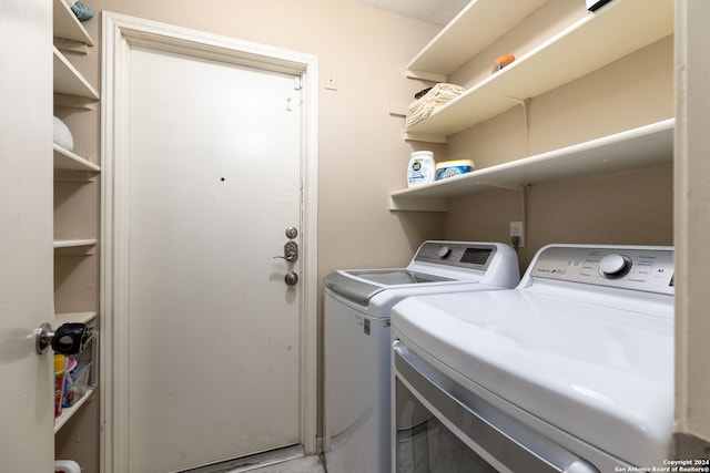 laundry room featuring washing machine and clothes dryer