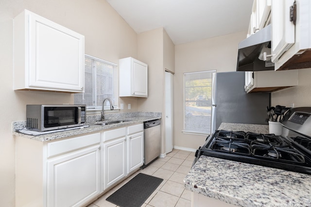 kitchen featuring stainless steel appliances, white cabinetry, and sink