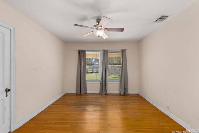 spare room featuring ceiling fan and wood-type flooring