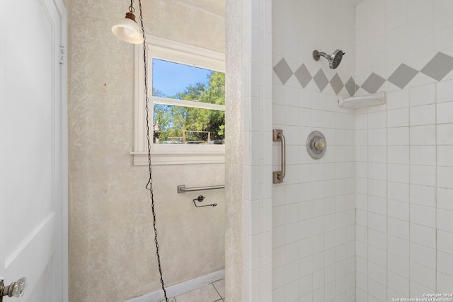 bathroom with tiled shower