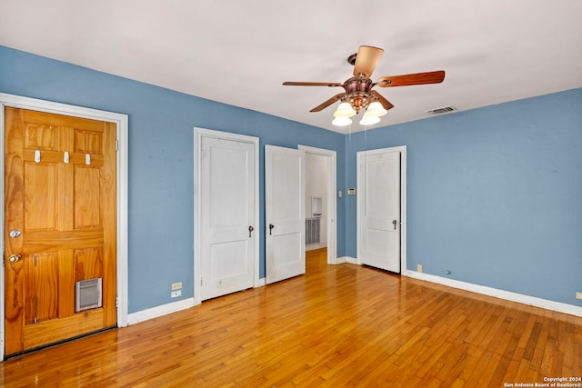 unfurnished bedroom with light hardwood / wood-style flooring and ceiling fan