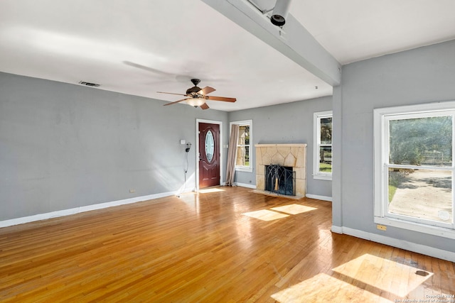 unfurnished living room with light hardwood / wood-style floors and ceiling fan