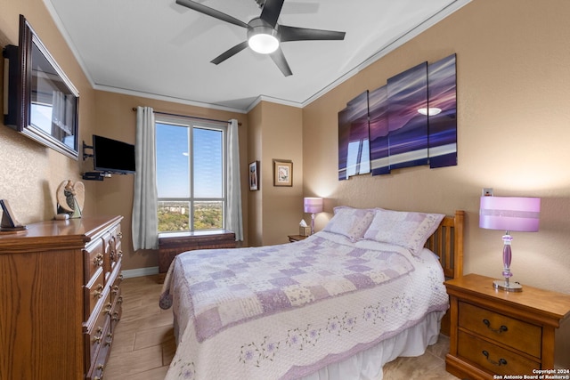 bedroom featuring ceiling fan and ornamental molding