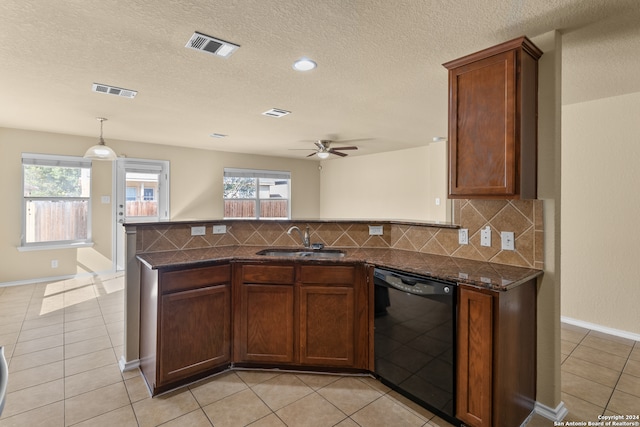 kitchen with sink, decorative backsplash, ceiling fan, light tile patterned floors, and black dishwasher