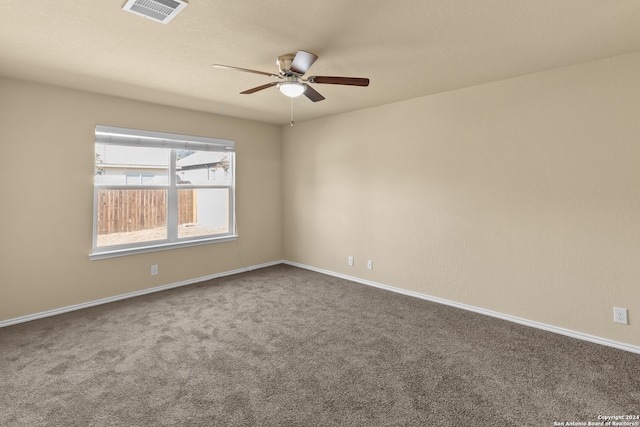 carpeted empty room with ceiling fan