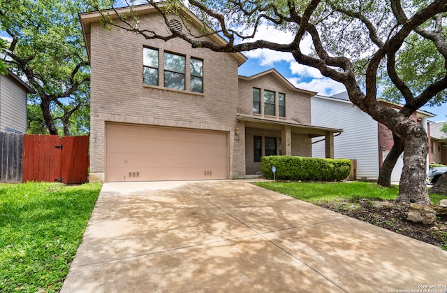 view of front of home featuring a garage and a front lawn