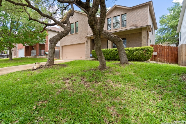 view of front facade with a garage and a front lawn