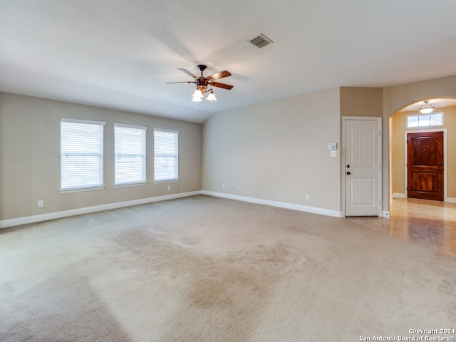 carpeted empty room with ceiling fan