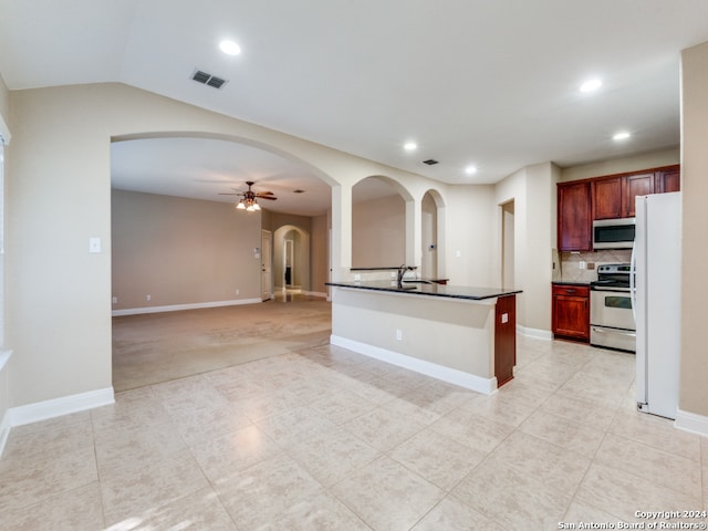 kitchen featuring ceiling fan, light tile patterned flooring, sink, and appliances with stainless steel finishes