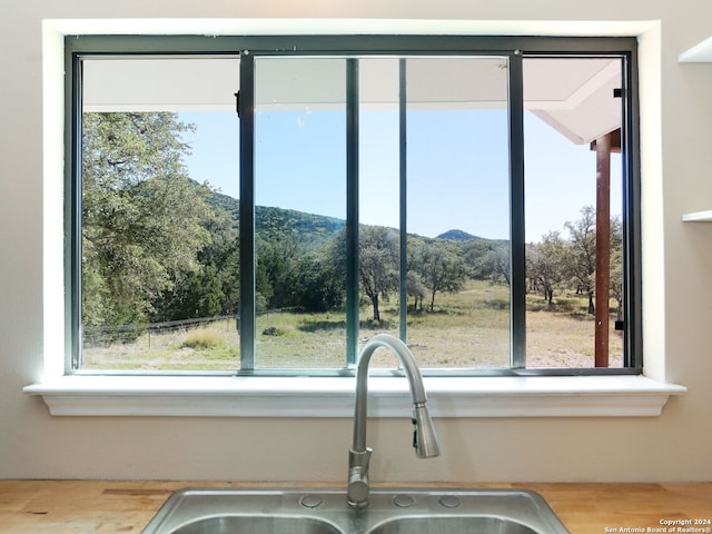 kitchen with a mountain view and sink