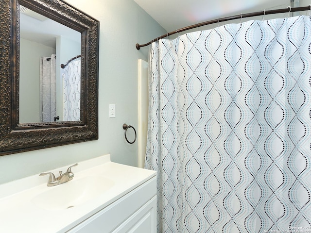 bathroom with vanity and a shower with shower curtain