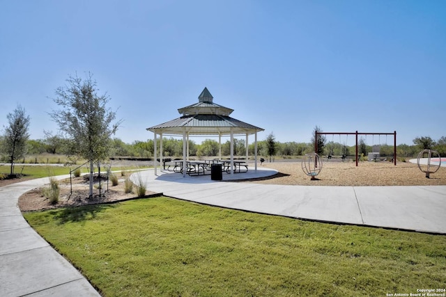 surrounding community featuring a gazebo, a yard, and a playground