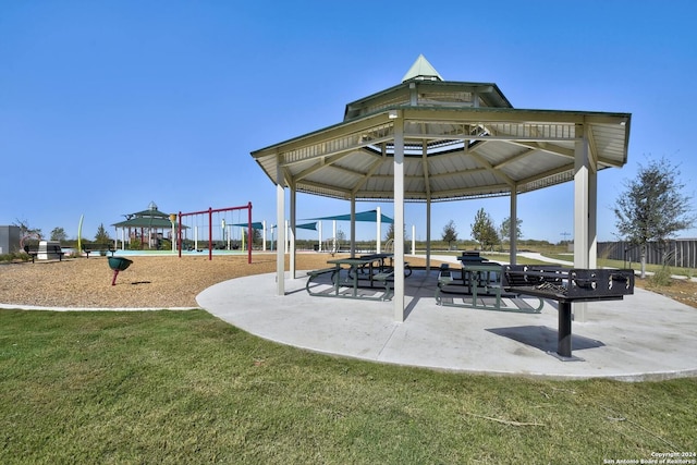 view of community with a lawn, a playground, and a gazebo