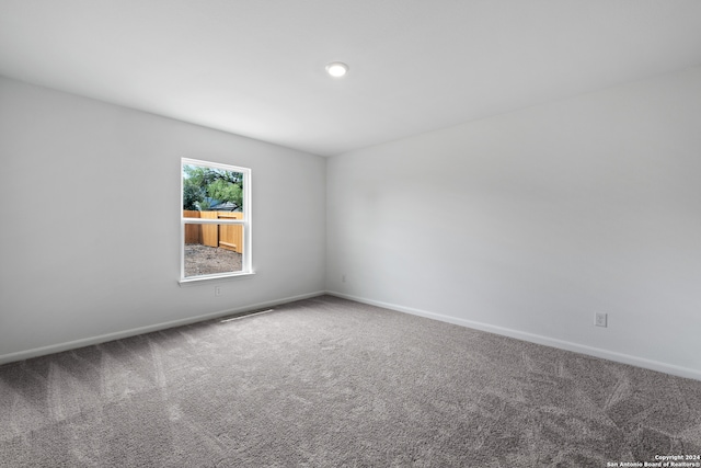 unfurnished room featuring carpet floors