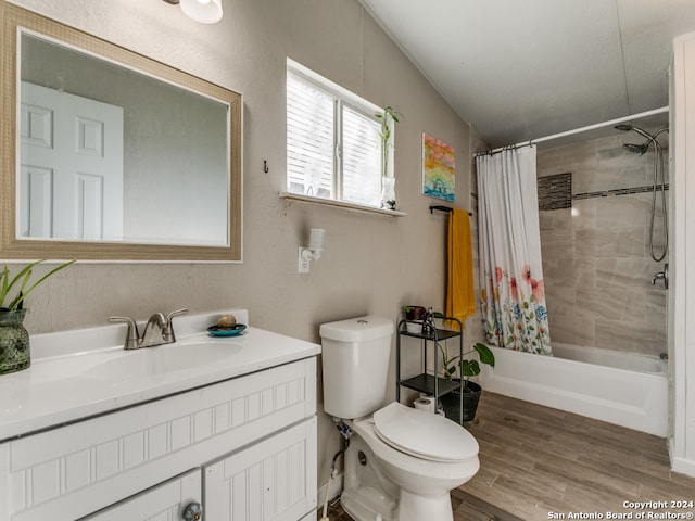 full bathroom with hardwood / wood-style floors, vanity, toilet, and shower / bath combo