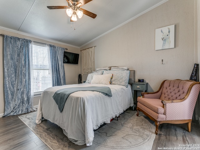 bedroom with ceiling fan, wood-type flooring, and ornamental molding