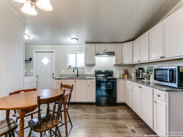 kitchen featuring white cabinets, sink, electric range, dark hardwood / wood-style floors, and light stone counters