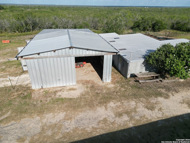 exterior space featuring a view of trees