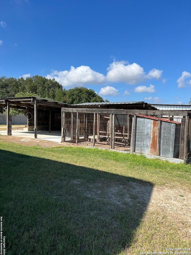 exterior space featuring an outbuilding and an exterior structure