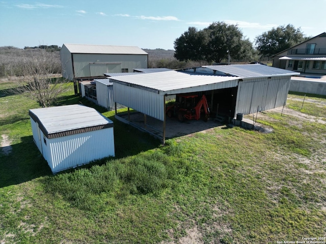 view of pole building with a yard