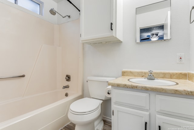 full bathroom featuring shower / bathing tub combination, vanity, toilet, and hardwood / wood-style floors