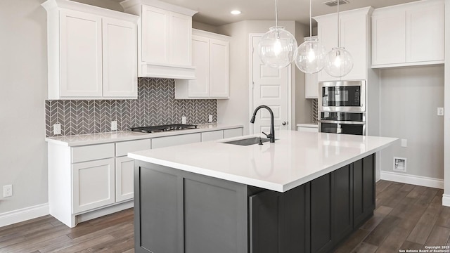 1863 Weinnacht, New Braunfels, TX 78132 - kitchen with a sink, stainless steel oven, baseboards, gas stovetop, and dark wood-style floors