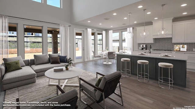 1863 Weinnacht, New Braunfels, TX 78132 - living area featuring dark wood-style floors and recessed lighting